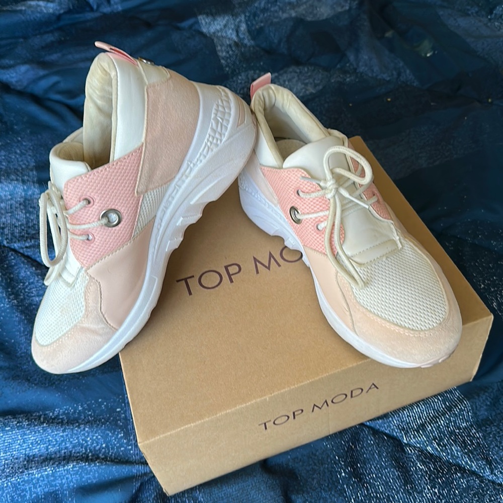 Pink and white athletic shoes